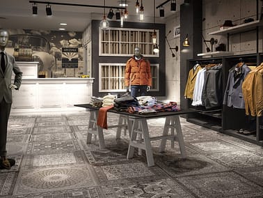 Tienda boutique de moda masculina con pavimento de Aparici cerámica de la colección Kilim. Representación en 3D.